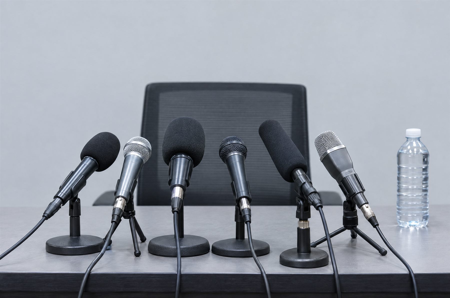 Microphones on a press conference table